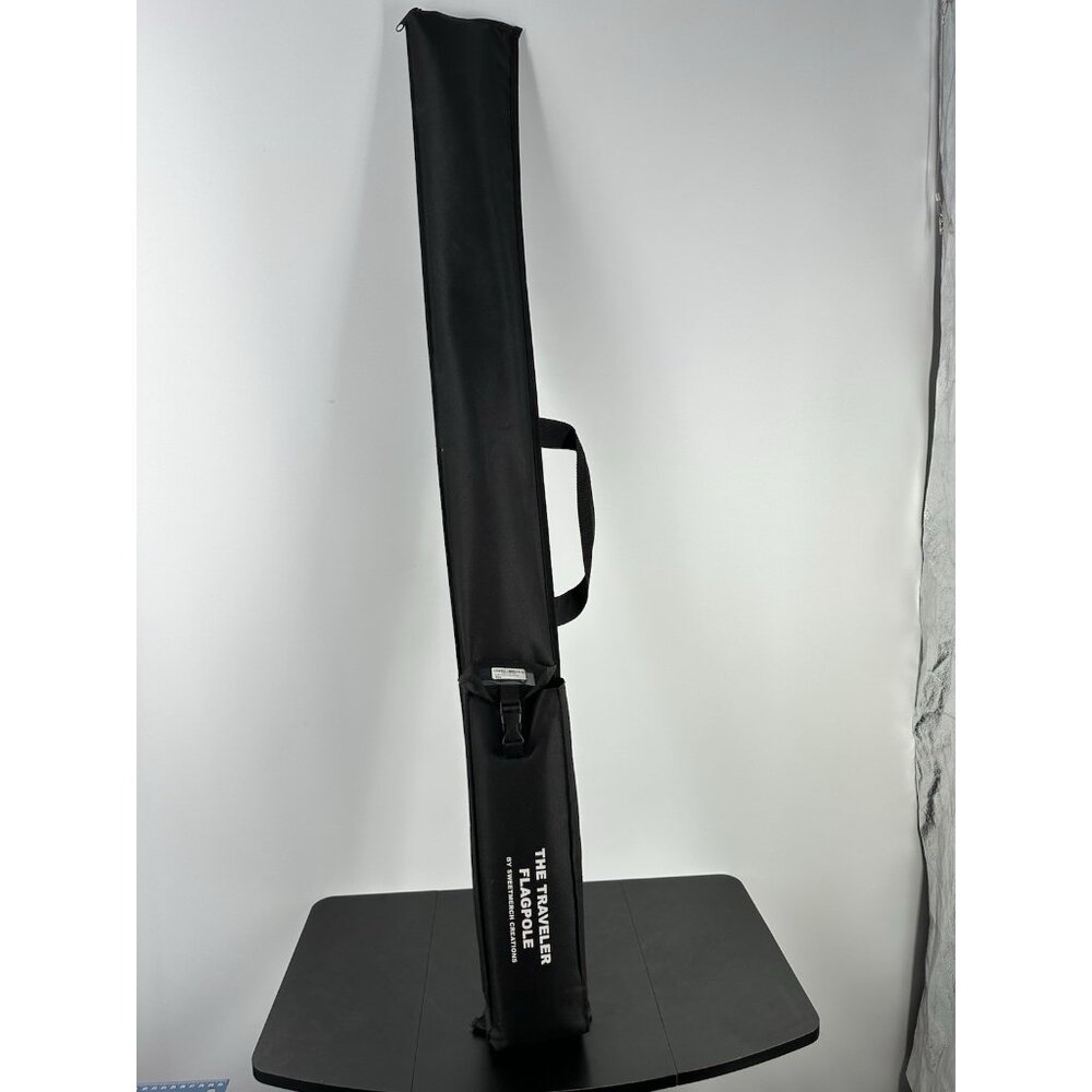 The Traveler Flag Pole Kit. Includes: Pole, 1 Flag, Carrying Case, Attachments.